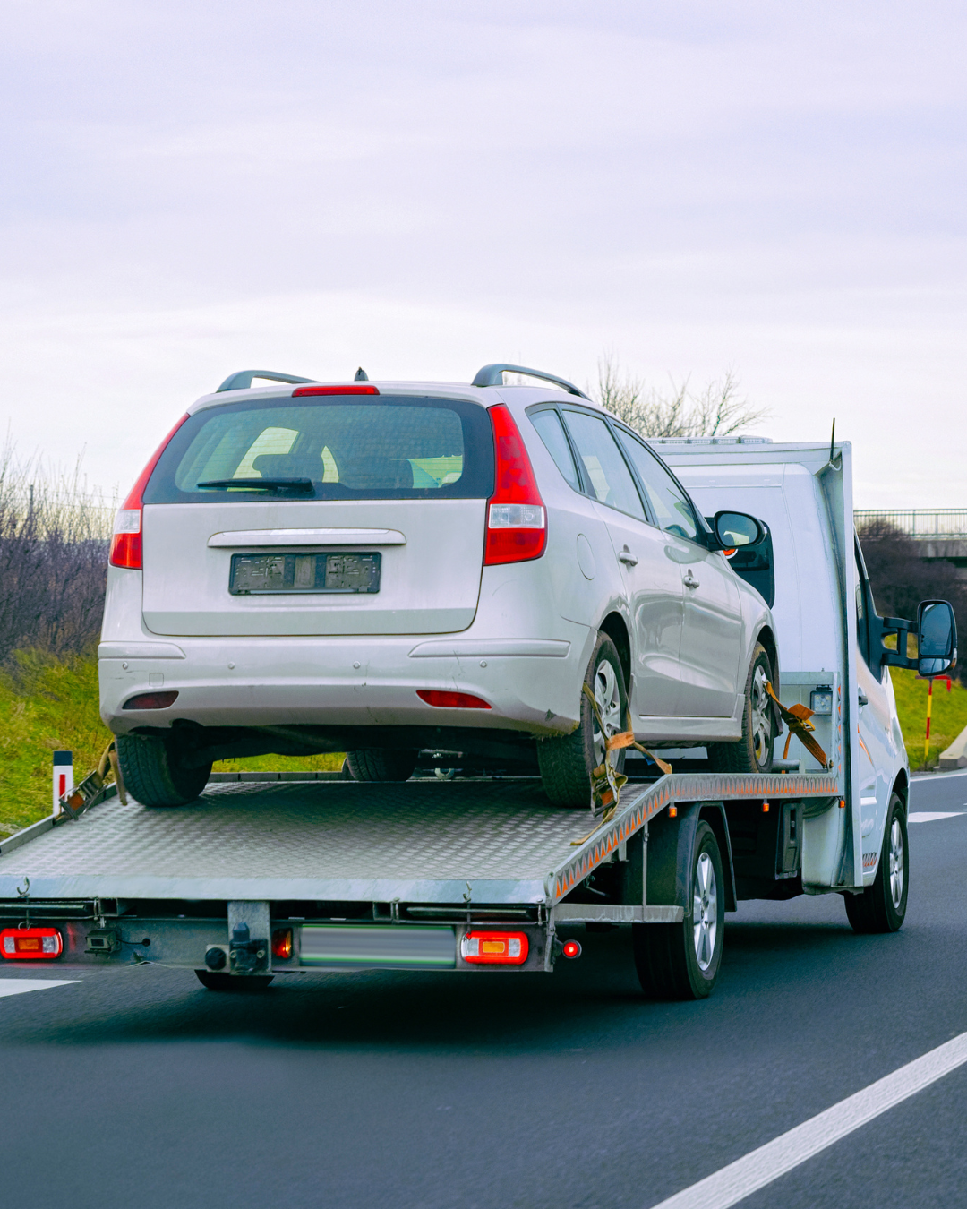 Tow truck picking up a car